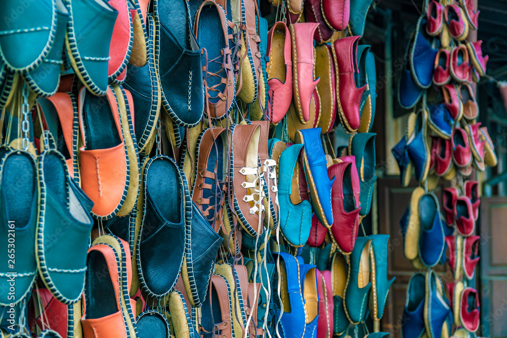 Traditional colorful Turkish handmade leather slipper shoes on a market in Gaziantep, Turkey.