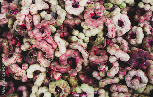 Pile of ripe Pithecellobium dulce beans (Manila Tamarind) in Thai market photo