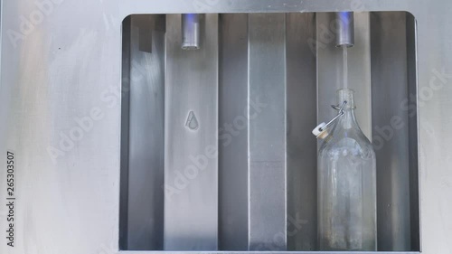 Ecological Life Zero Waste Filling A Reusable Glass Bottle With Water By Water Dispenser 