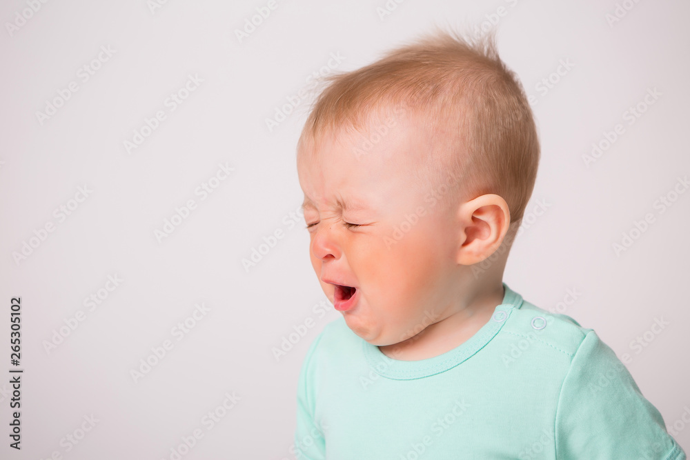 baby boy 6 months crying on white background baby boy 6 months crying on white background