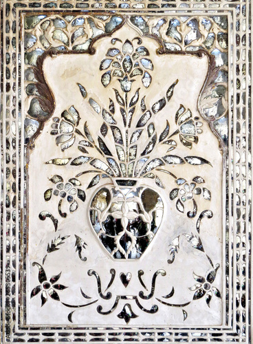 Mirror mosaic on the wall of the ancient palace Sheesh Mahal XVII century in the old Amber Fort, Jaipur, India