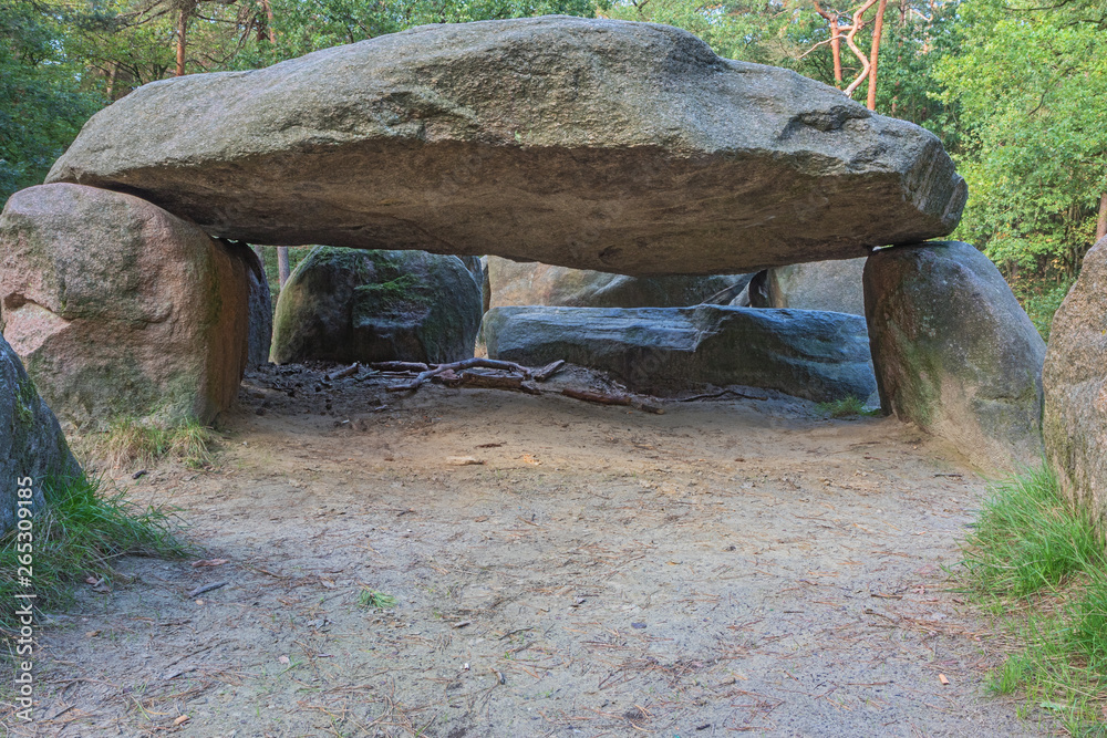 Looking under the cover stone of Dolmen D45 in the vicinity of Emmen. Looking under the cover stone of Dolmen D45 in the vicinity of Emmen.