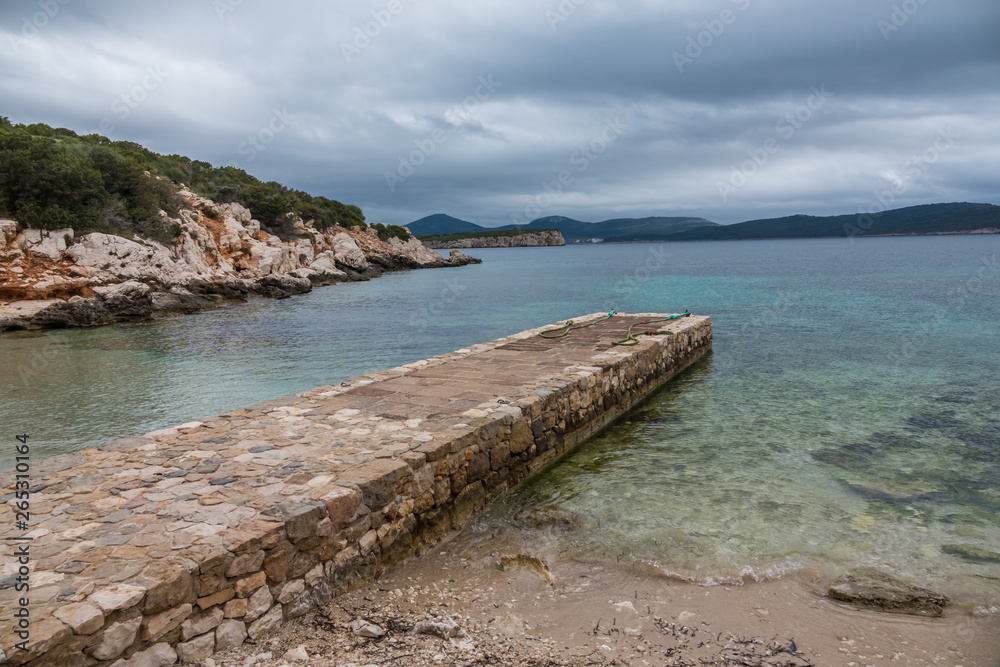 Capo Caccia nature reserve, a rocky outcrop set in a protected ecosystem near the town of Alghero, Sardinia, Italy. featuring. Scenic hiking routes, diving sites & caverns with archaeological remains