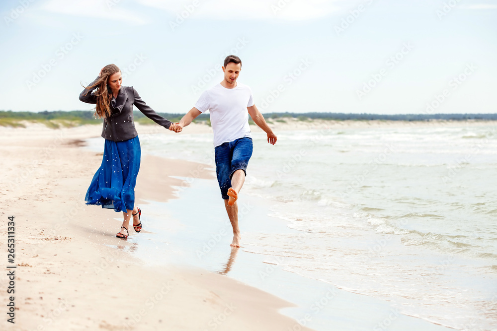 Young couple having fun on the beach.