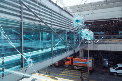 Bullet hole in glass.