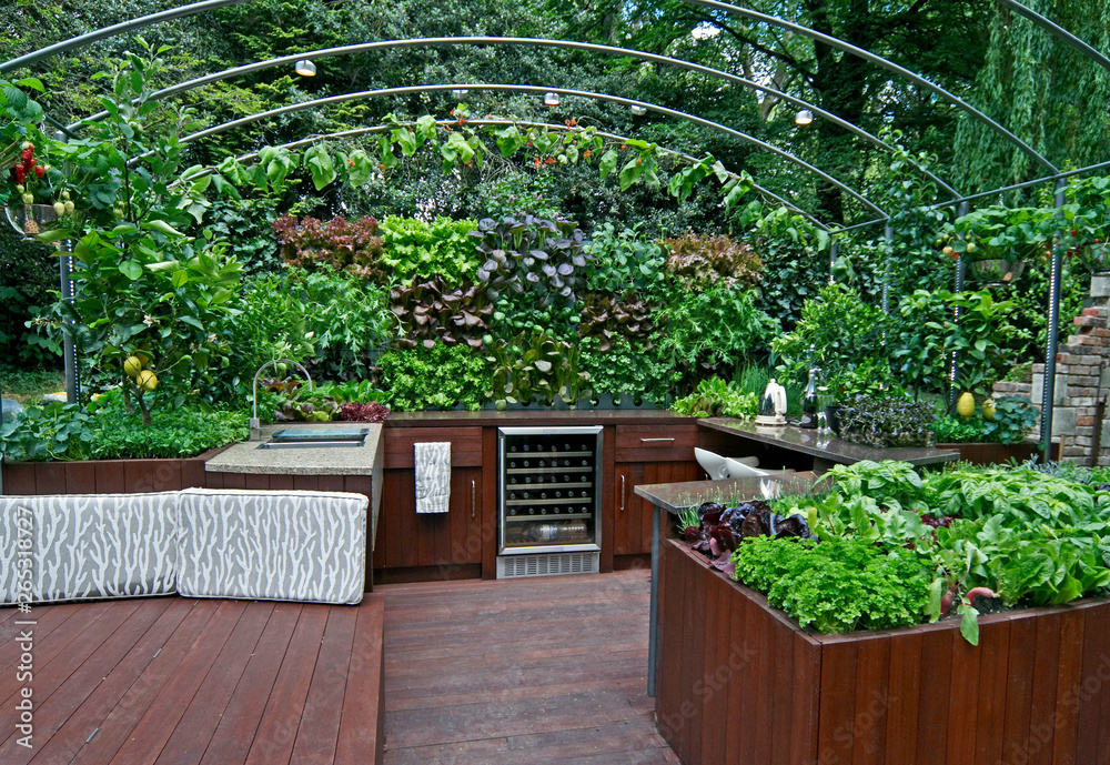 An outdoor kitchen with a ready supply of fresh herbs and vegetables in a vertical garden An outdoor kitchen with a ready supply of fresh herbs and vegetables in a vertical garden