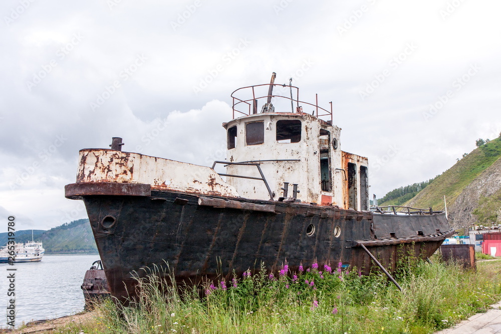 Old rusty fishing boat near the shore Old rusty fishing boat near the shore
