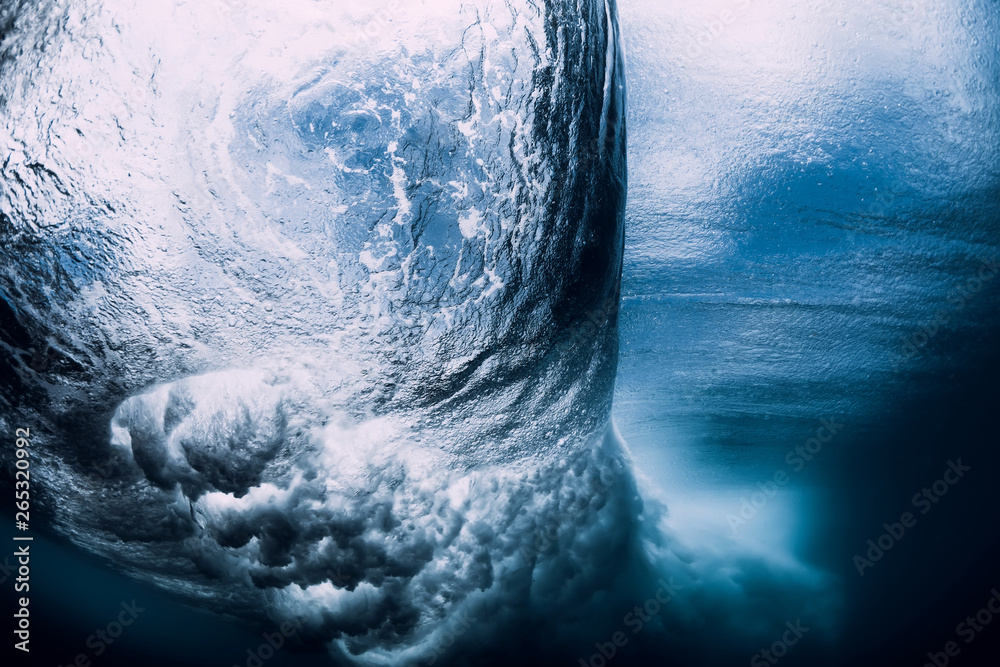 Fototapeta premium Barrel wave underwater with air bubbles. Ocean in underwater