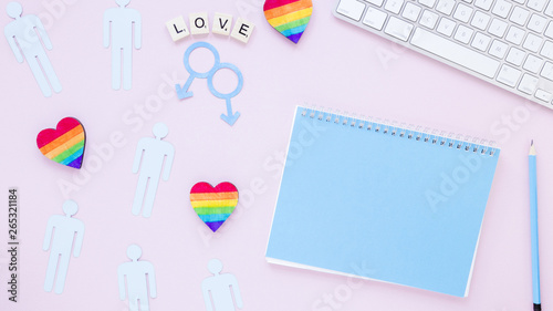 Love inscription with hearts, gay couples icons and notepad