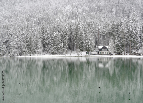 Schilderij op canvas Snow falling over Dobiacco lake in Italy, Europe