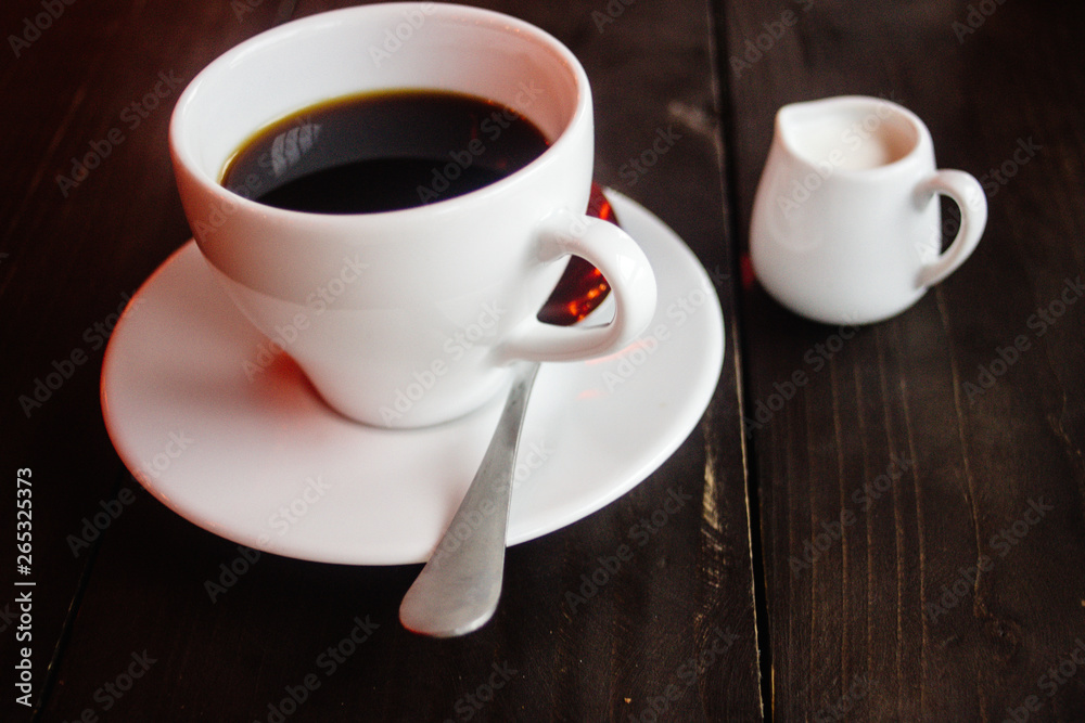 beautiful stylish stunning white cups with coffee and milk on a wooden table