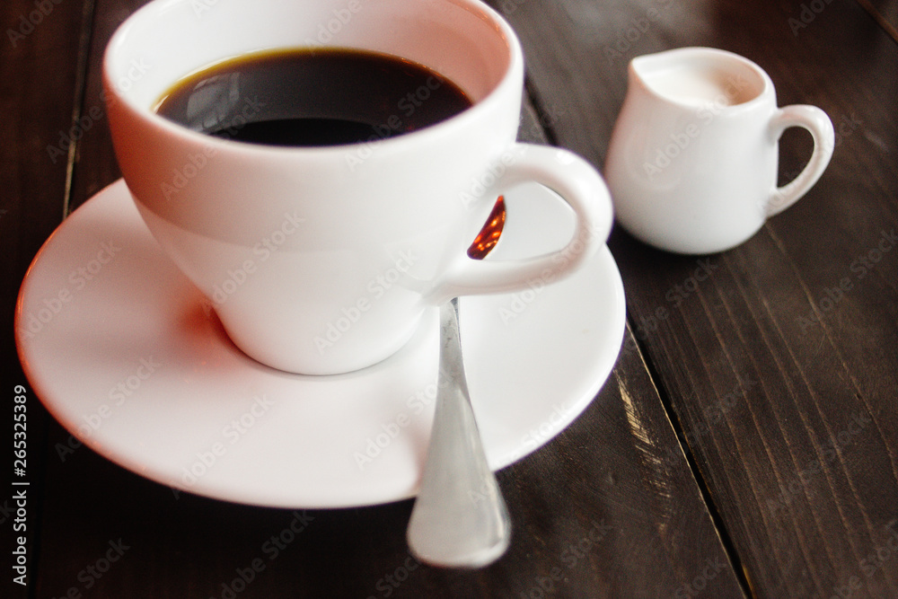 beautiful stylish stunning white cups with coffee and milk on a wooden table beautiful stylish stunning white cups with coffee and milk on a wooden table
