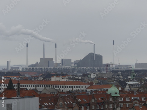 COPENHAGEN, DENMARK - MARCH 2019: Incinerator. Pipes smoke. Ecology. photo