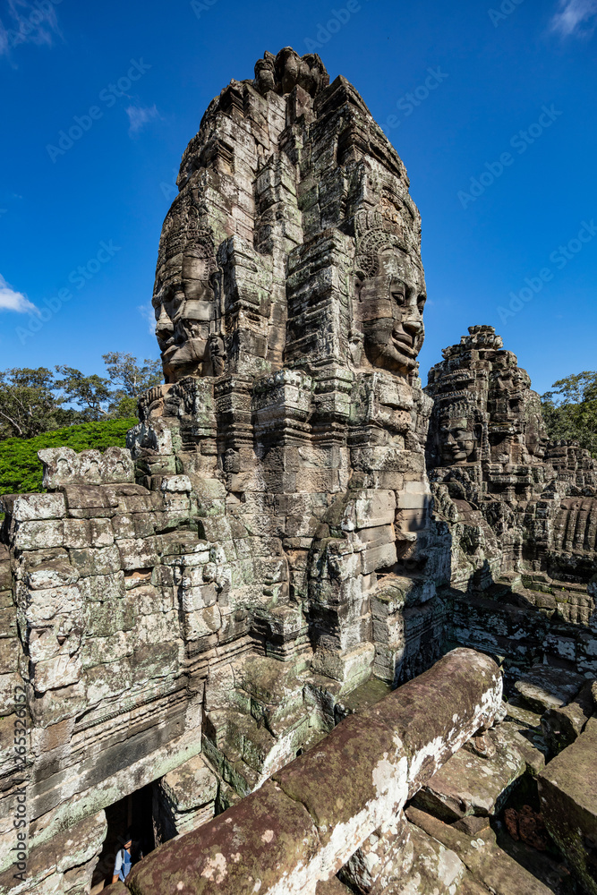 Beautiful face sculptures at the famous Bayon temple in the Angkor Thom temple complex, Siem Reap, Cambodia