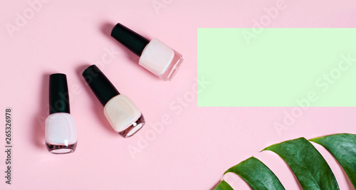 Nail polish. Decorative cosmetic. Delicate colors. Green leaf monstera.