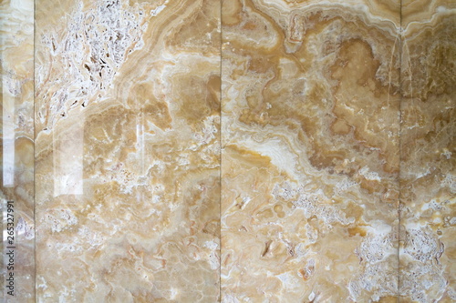 Beautiful onyx stone natural texture patterns, design wall, modern architecture, white, yellow and brown colors photo