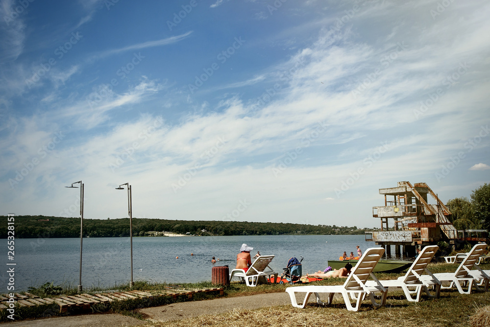 amazing beautiful landscape of beach with white chairs, summer travel concept