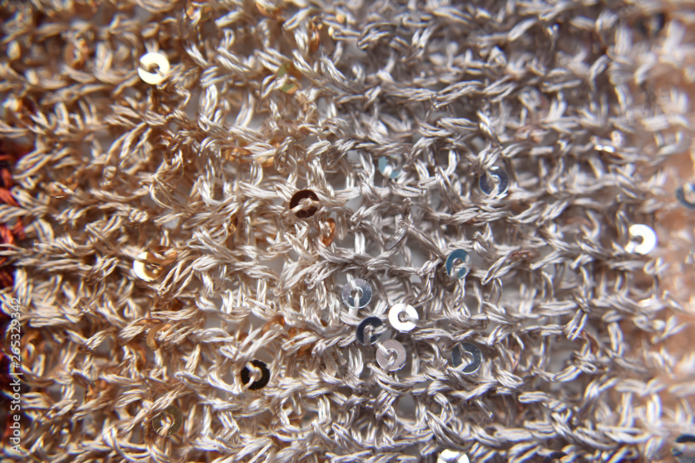 Knitted texture of fabric with sequins Knitted texture of fabric with sequins
