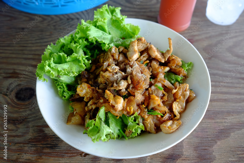 Stir-Fried Rice Noodle with Chicken. It is Famous Thai Recipe.