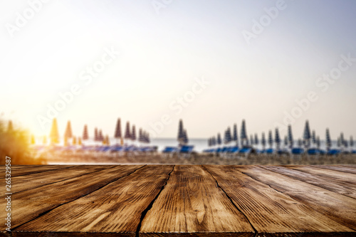 Table background of free space for your decoration and morning blurred background of beach and sea 