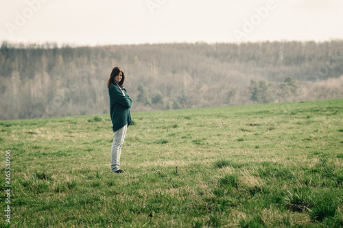 stylish beautiful brunette girl walking with photocamera outdoors in spring