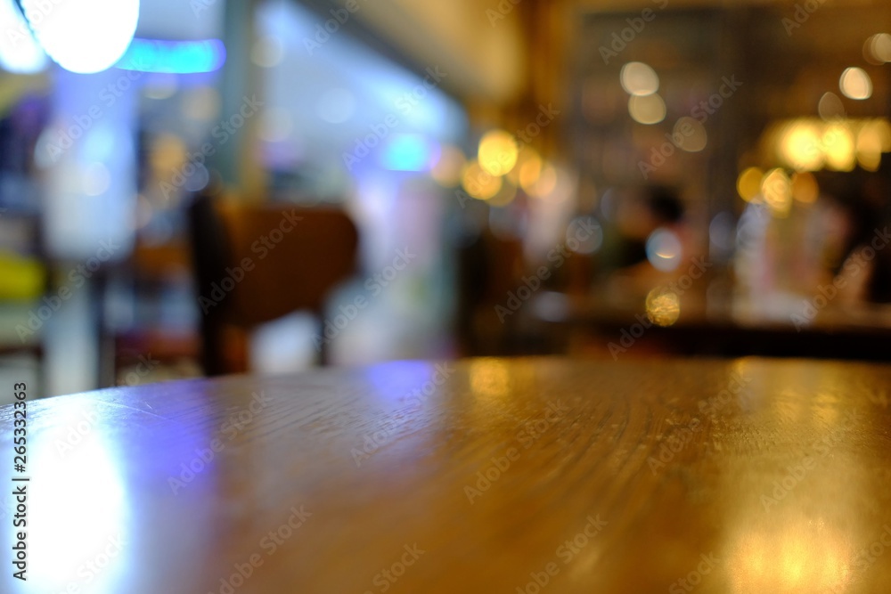 Close up Surface of Wooden Table in Cafe with Bokeh Background. (Selective Focus)