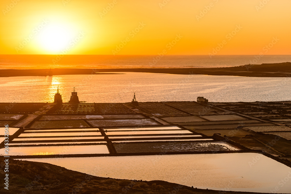 Sunset at Salinas de Janubio. Old salt pans in the south of Lanzarote were they harvest salt the traditional way