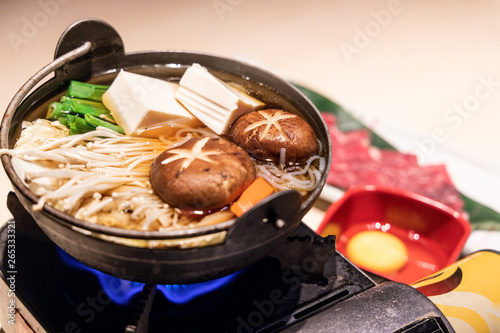 Japanese sukiyaki hot pot with vegetable, beef slice, raw egg