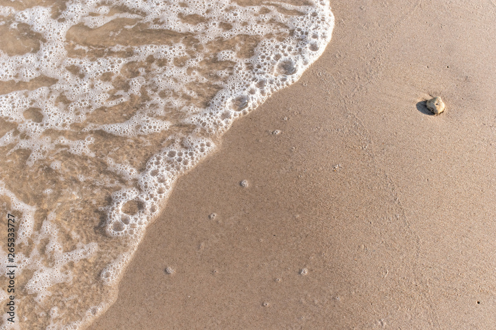 Top view sand background Copy space for text. Sea beach and soft wave. Top view sand background Copy space for text. Sea beach and soft wave.