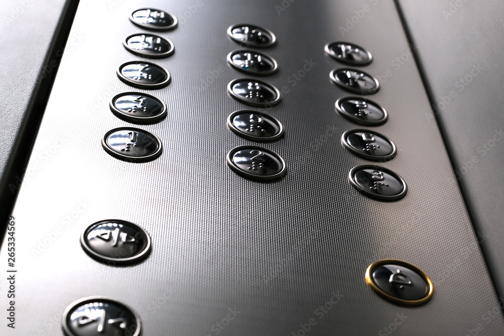 Tactile digit icons for the visually impaired. Elevator buttons. Selective focus close-up. Tactile digit icons for the visually impaired. Elevator buttons. Selective focus close-up.