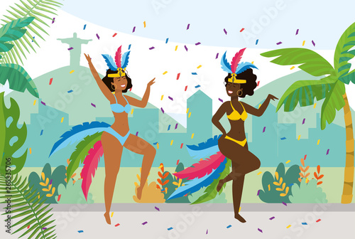 cute girls dancers with costume and feathers