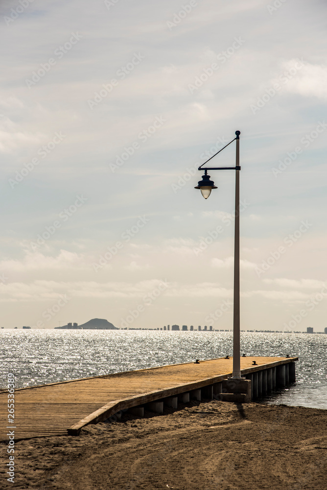 different shots of a lamppost at the pier of the Mar Menor