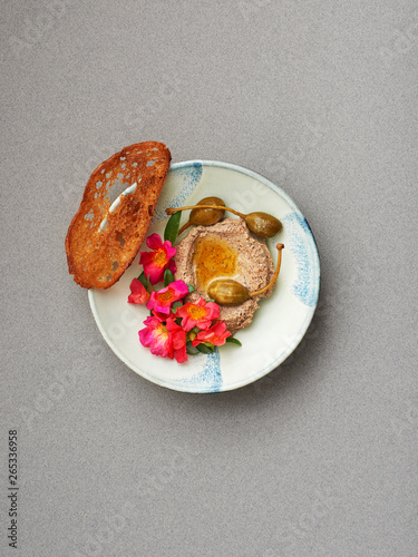 Duck lever with Spanish theme flowers and bread photo