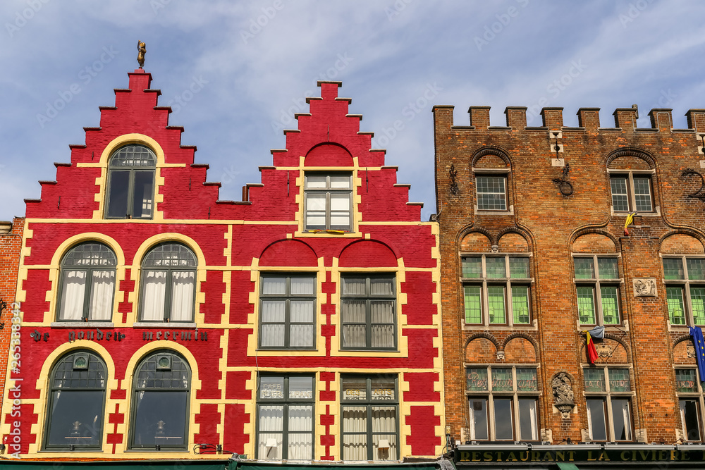 Typical colored houses on the Grote Markt or Market Square in the center of Bruges city, Belgium