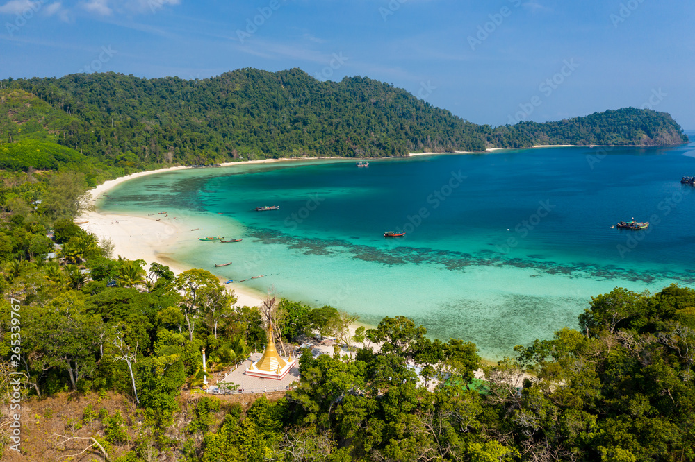 Aerial drone view of a Buddhist pagoda overlooking a tropical sandy beach (Great Swinton Island, Mergui Archipelago, Myanmar) Aerial drone view of a Buddhist pagoda overlooking a tropical sandy beach (Great Swinton Island, Mergui Archipelago, Myanmar)