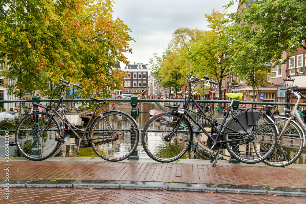 Bikes on bridge over Amsterdam canal, Amsterdam, Netherlands