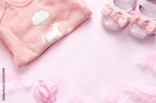 Baby pink accessories on pink background. 