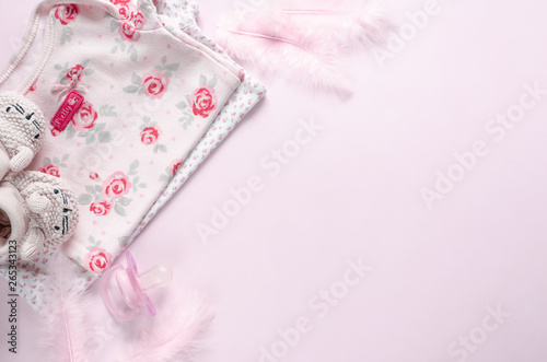 Baby pink accessories on pink background.