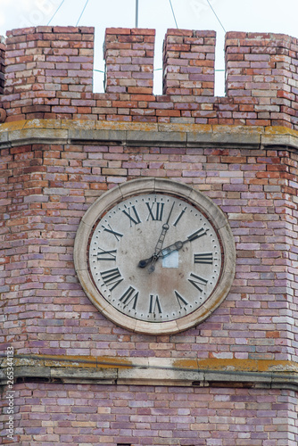 Tower clock. Orenburg, Russia - April, 06, 2019: The clock on the tower of the museum of the History of Orenburg, the former guardhouse