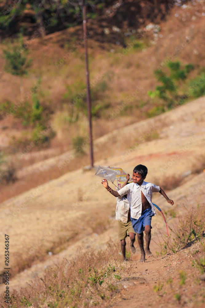 indian child playing with kite