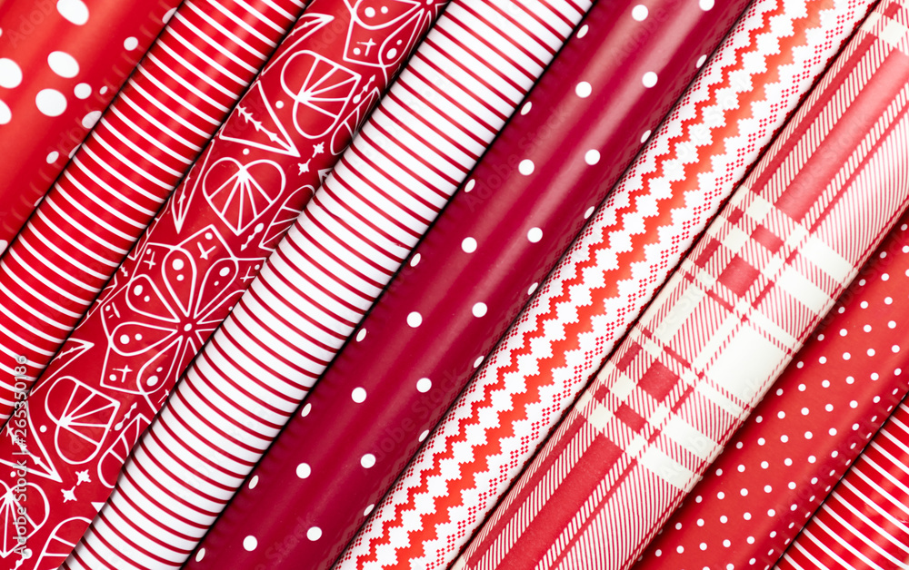 Red and White Gift Wrapping Paper Rolls in Variable Colors Stock Photo