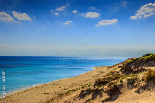 Summer seascape  Apulia coast  Marina di Lizzano beach  Taranto . The coastline is characterized by a alternation of sandy coves and jagged cliffs overlooking a truly clear and crystalline sea.