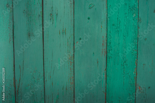 Background of green flaky wood Backdrop of green colored wooden panels with aged flaky surface