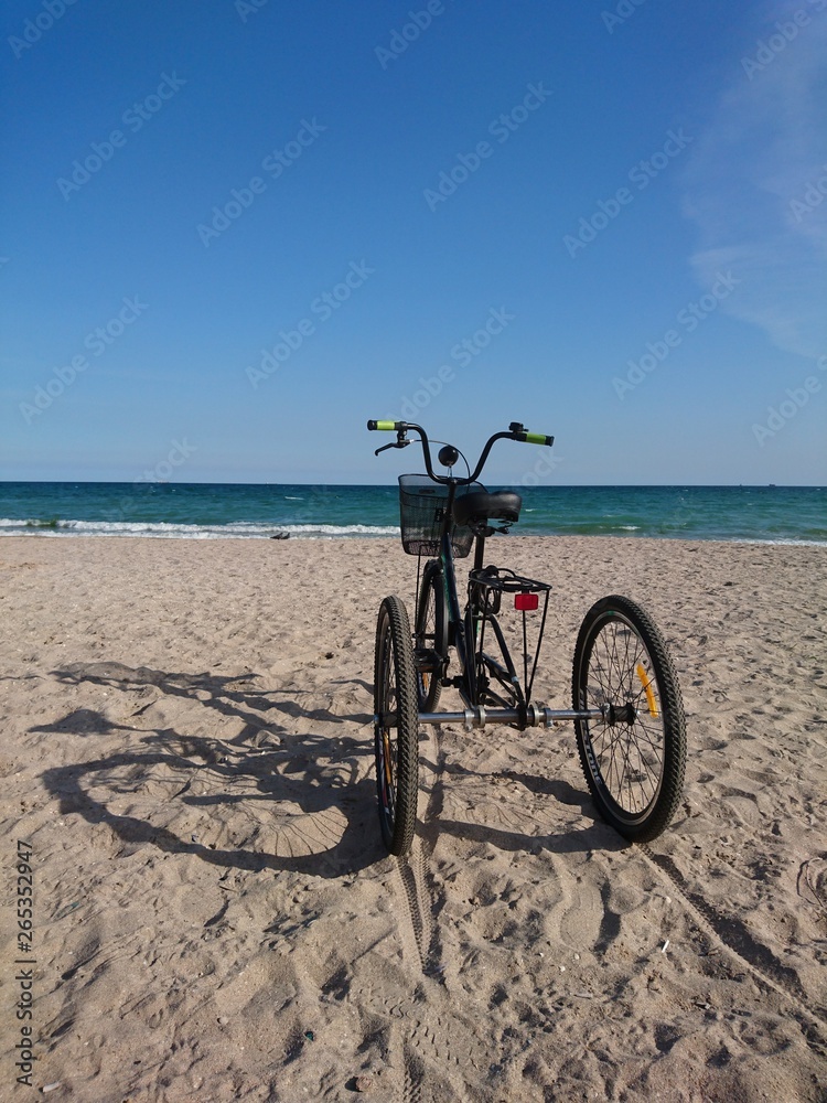 Fototapeta premium unusual tricycle on the seashore