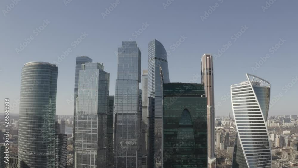 Aerial view on Moscow city skyscrapers and Moscow river. Sunny, blue sky, spring. Cars driving on the motorway. Aerial view on Moscow city skyscrapers and Moscow river. Sunny, blue sky, spring. Cars driving on the motorway.