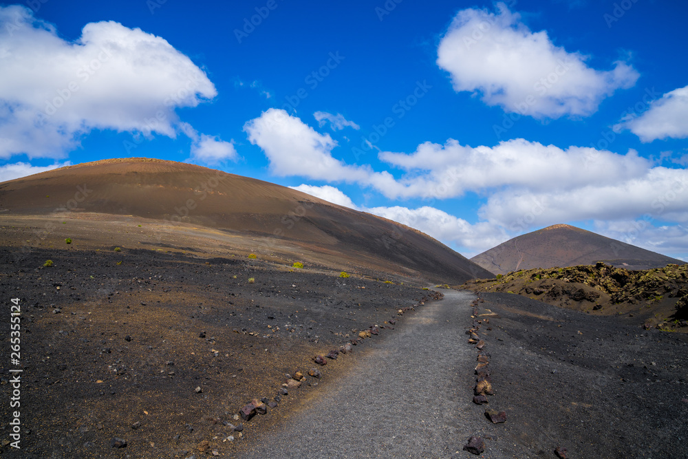 Spain, Lanzarote, Volcanic trail through colorful volcanic mountains and lava landscape