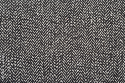 Herringbone tweed wool fabric as background © sss615