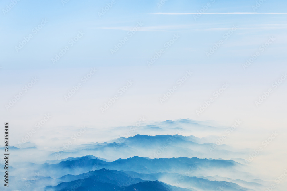 Aerial landscape mountains lost in thick fog in China, bird eye view landscape look like a chinese style of painting