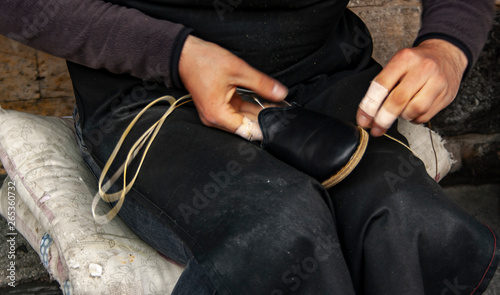 Cropped image of young  traditional shoemaker making shoes at Gaziantep, Turkey.