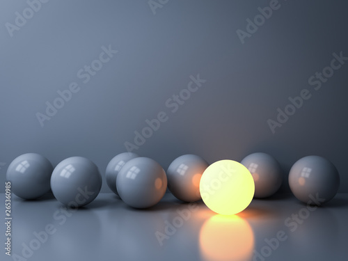 Stand out from the crowd and Leadership creative idea concepts One luminous sphere shining among other dim spheres on white background in the dark with reflections and shadows 3D rendering